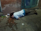 man on street gutter alcohol vomit 800x600