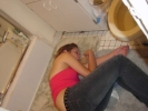 woman on bathroom floor alcohol vomit 800x600