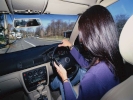 woman on phone driving 1024x768
