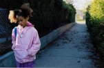 teenager girl walking home ally
