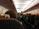 7 flying ej inflight stewardess in corridor