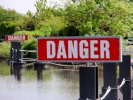 aversive danger sign on river