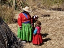 people tribal woman and children on lake bank p1000853 b