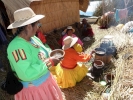 people women and children cooking on lake bank tribal p1000810 b